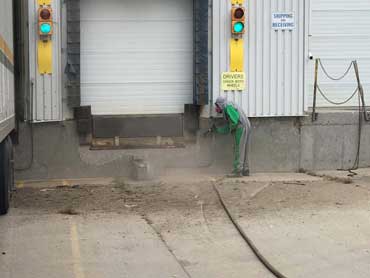 Sand and soda blasting masonry buildings